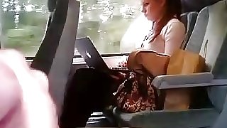 Girl on train distracted by wanker